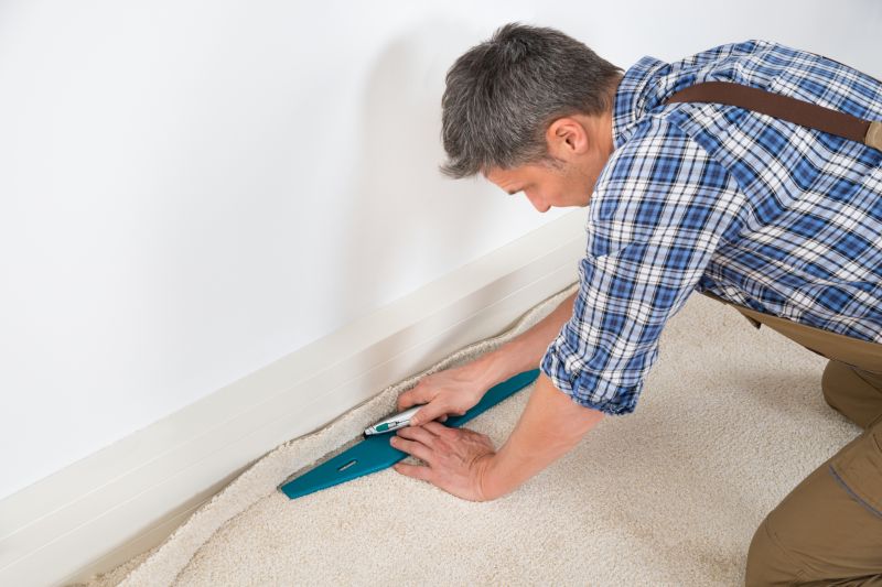 Professional Carpet Installer at Work